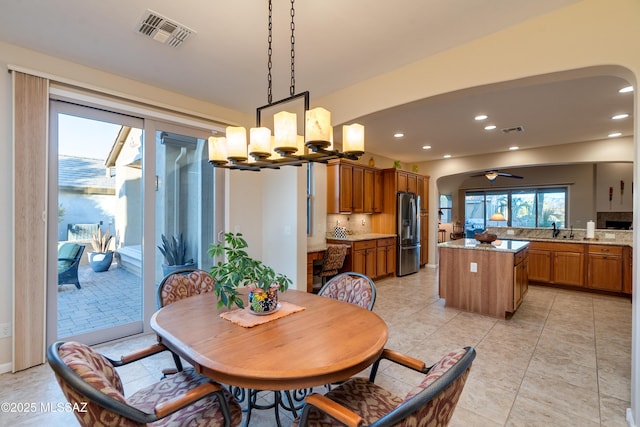 dining room with recessed lighting, visible vents, and plenty of natural light