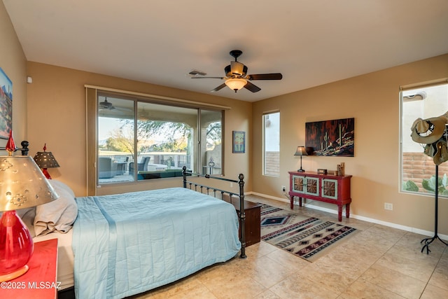 tiled bedroom with a ceiling fan, visible vents, and baseboards