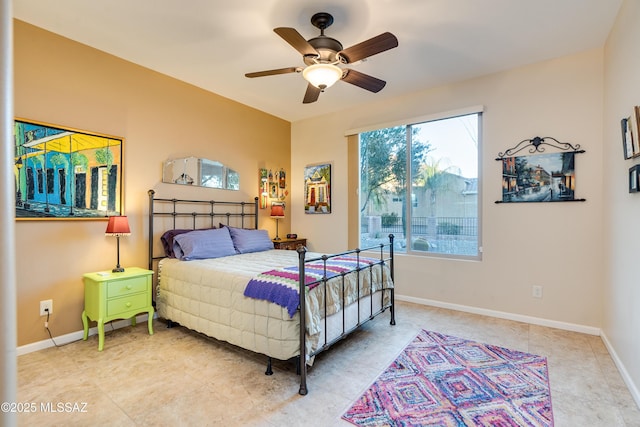 bedroom featuring a ceiling fan and baseboards