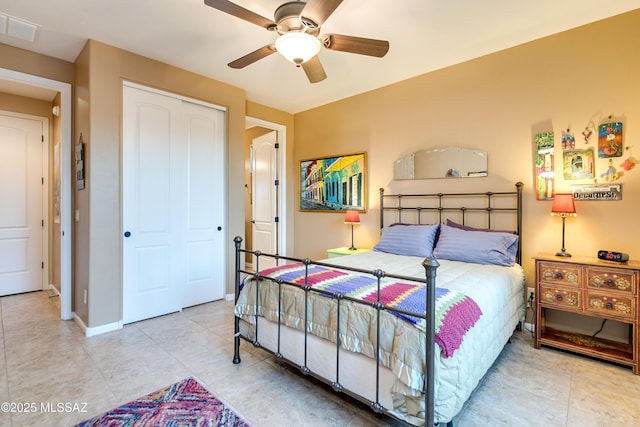 bedroom featuring a closet, visible vents, ceiling fan, and baseboards