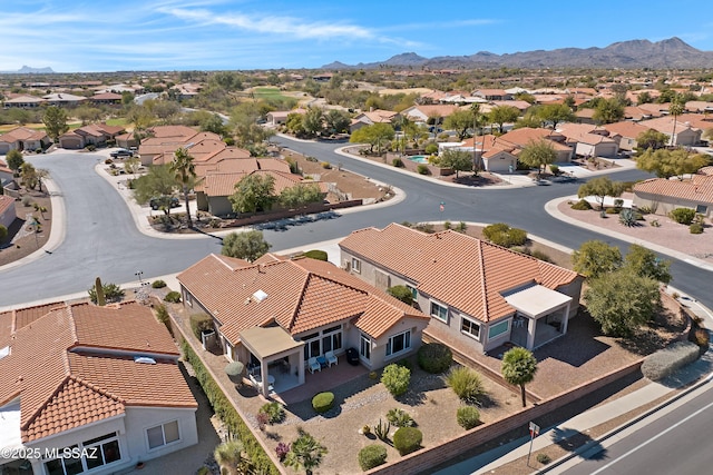 drone / aerial view featuring a residential view and a mountain view