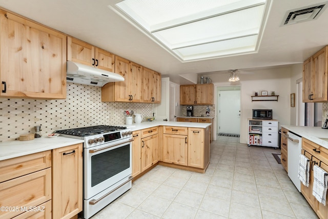 kitchen with white appliances, visible vents, under cabinet range hood, and light brown cabinets