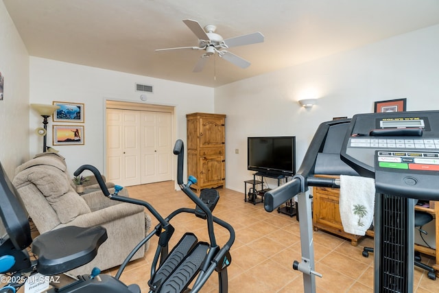 workout area with light tile patterned floors, visible vents, and a ceiling fan