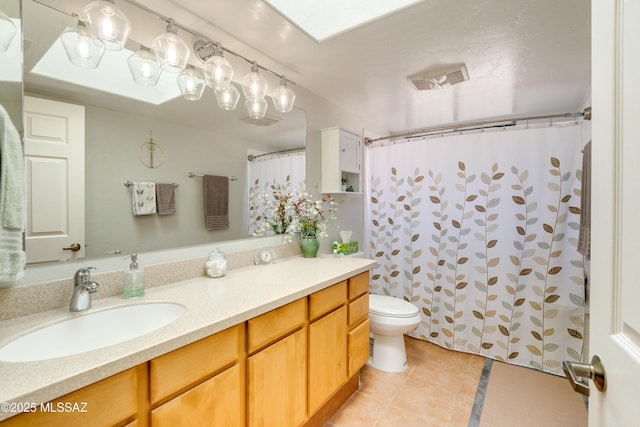 bathroom with tile patterned flooring, toilet, visible vents, vanity, and a shower with curtain