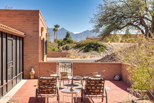 view of patio / terrace featuring a mountain view