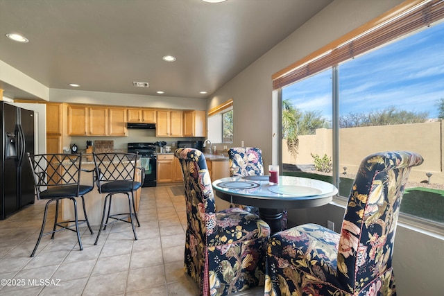 dining area featuring visible vents, light tile patterned flooring, and recessed lighting