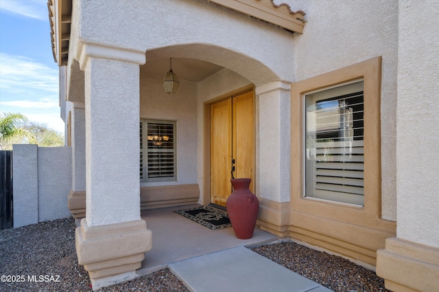 doorway to property with stucco siding