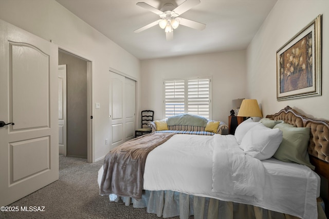 carpeted bedroom featuring ceiling fan and a closet