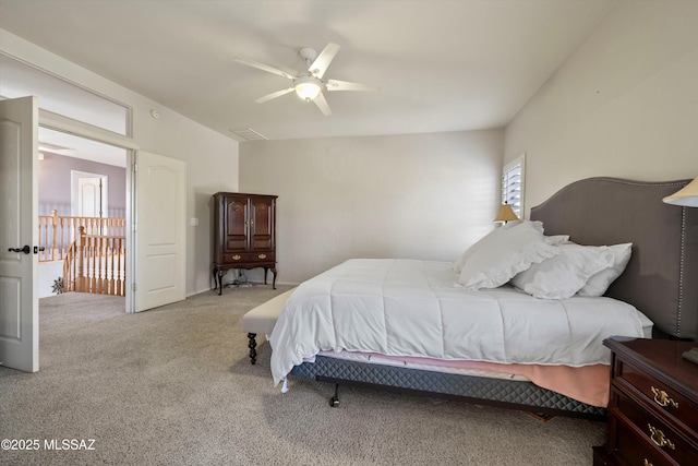 bedroom with ceiling fan and light colored carpet