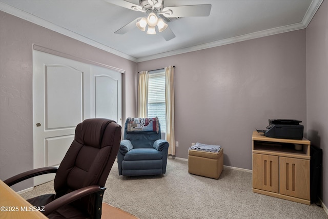 home office featuring light carpet, ceiling fan, ornamental molding, and baseboards