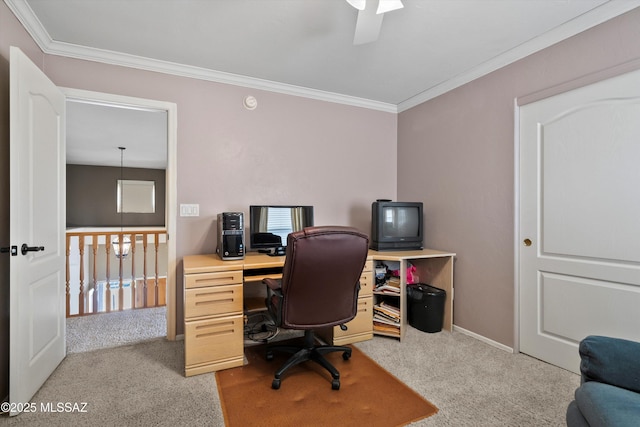 office space with light carpet, ornamental molding, and baseboards