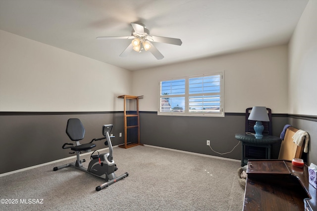 workout area featuring ceiling fan, carpet flooring, and baseboards