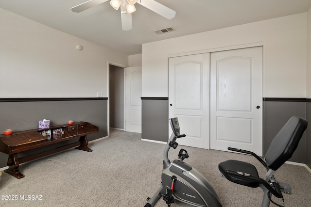 exercise area featuring ceiling fan and visible vents