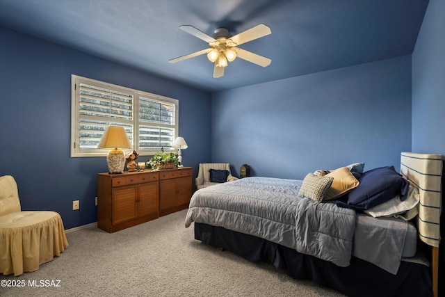 bedroom with carpet floors, ceiling fan, and baseboards