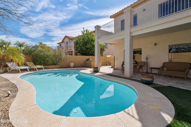 view of pool featuring a patio, a fenced backyard, and a fenced in pool