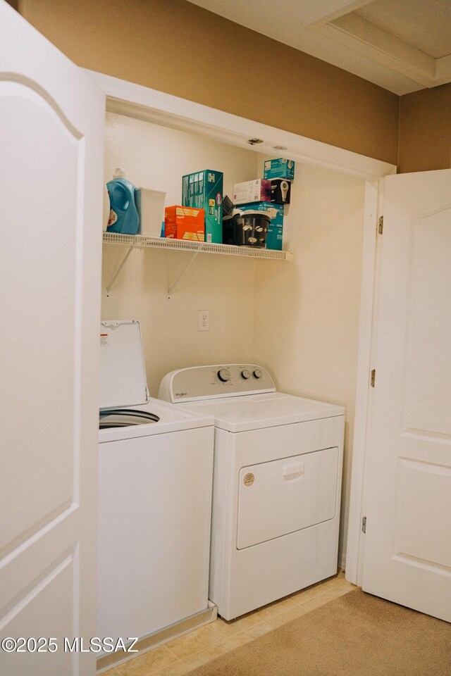 clothes washing area featuring laundry area and separate washer and dryer