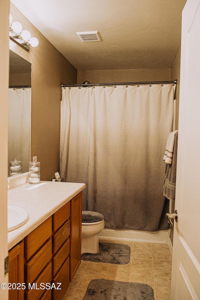 bathroom with curtained shower, tile patterned flooring, toilet, vanity, and visible vents