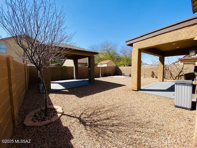 view of yard with a fenced backyard and a patio