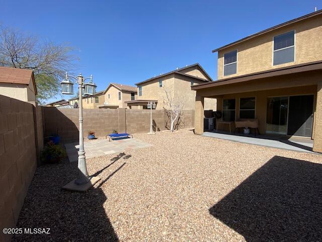 view of yard featuring a fenced backyard and a patio