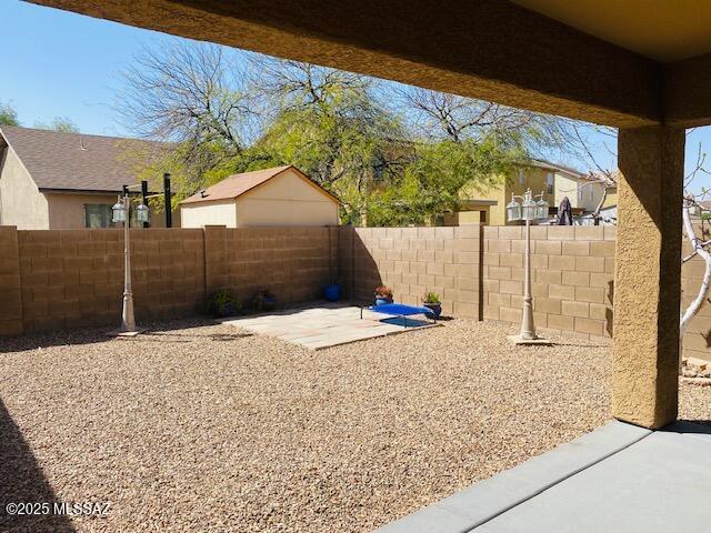 view of yard with a fenced backyard and a patio