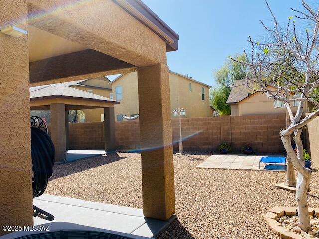 exterior space featuring a fenced backyard and a patio