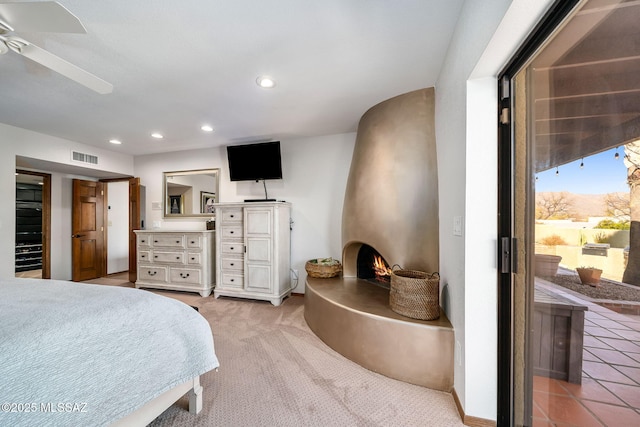 bedroom featuring baseboards, visible vents, light colored carpet, a fireplace, and recessed lighting