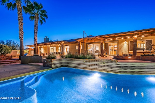 pool with a patio