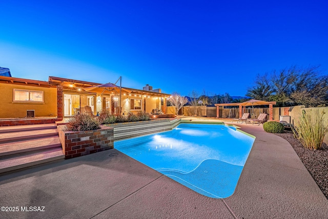 view of pool with a fenced in pool, a fenced backyard, and a patio