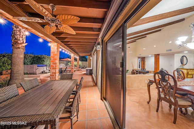 view of patio with visible vents, outdoor dining area, and a ceiling fan