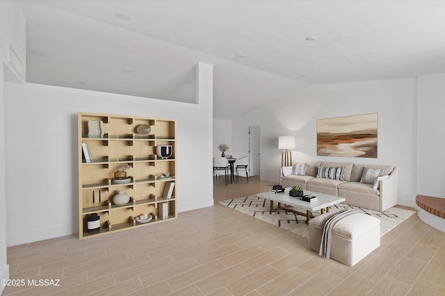 living room with wood finish floors and lofted ceiling