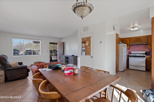 dining room with light tile patterned flooring and visible vents