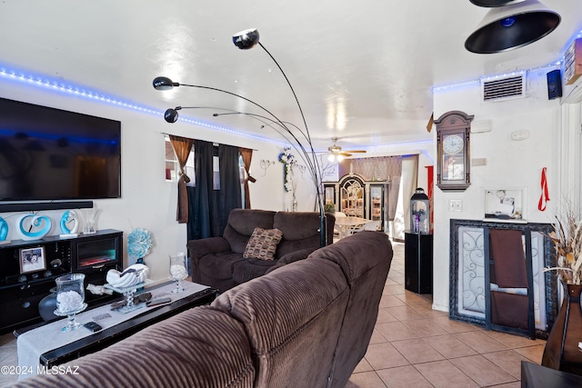 living room featuring visible vents, a ceiling fan, and light tile patterned flooring