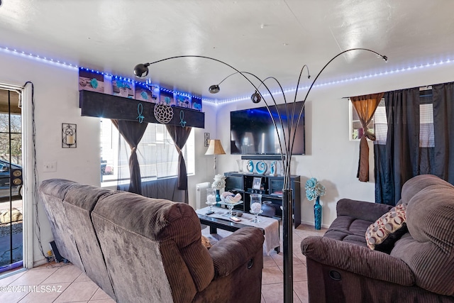 living area featuring light tile patterned flooring