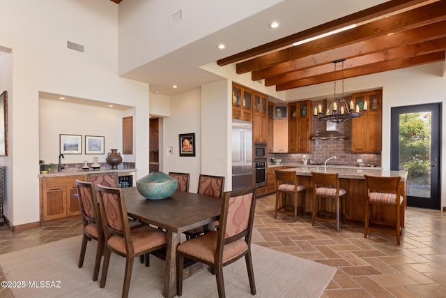 dining room with visible vents, beamed ceiling, stone tile floors, recessed lighting, and a notable chandelier