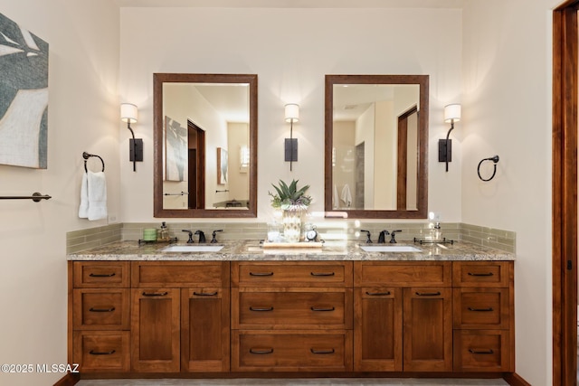 full bathroom with a sink, decorative backsplash, and double vanity