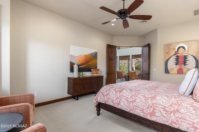 bedroom featuring visible vents, carpet floors, baseboards, and ceiling fan