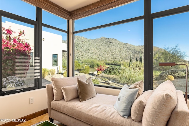 sunroom with a mountain view