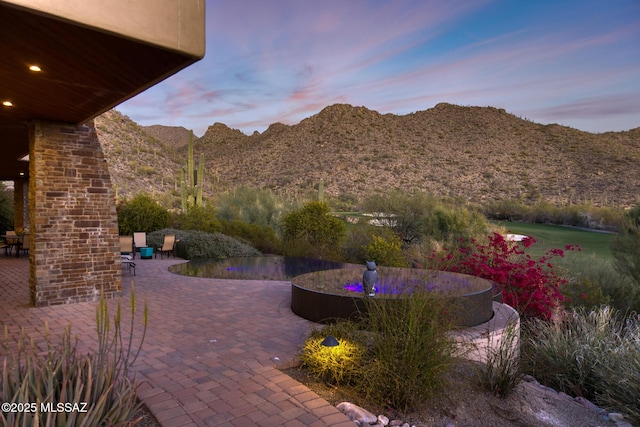 view of patio / terrace with a mountain view