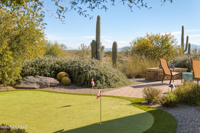 view of property's community with a patio area