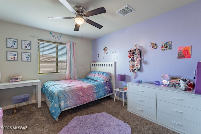 bedroom with a ceiling fan, dark colored carpet, visible vents, and baseboards