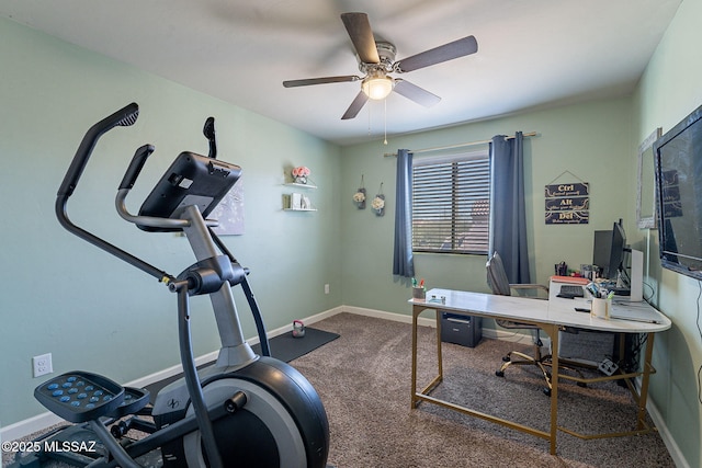 office area featuring dark colored carpet, a ceiling fan, and baseboards