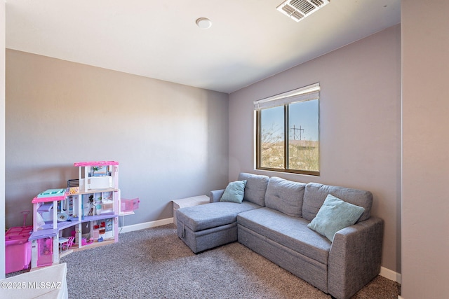 carpeted living area featuring baseboards and visible vents
