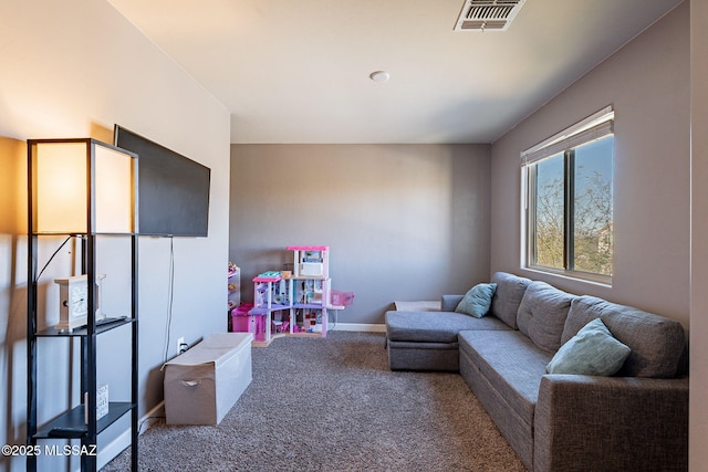 interior space with carpet floors, visible vents, and baseboards