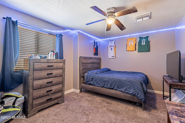 bedroom featuring carpet floors, baseboards, visible vents, and a ceiling fan