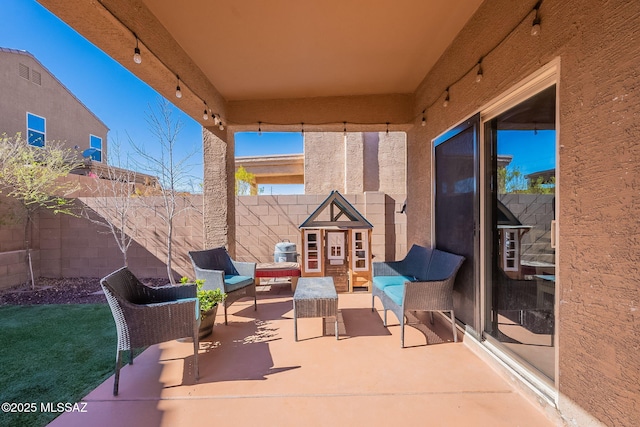 view of patio / terrace featuring a fenced backyard and an outdoor living space