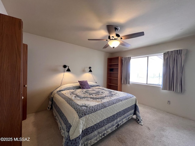 bedroom featuring ceiling fan and carpet floors