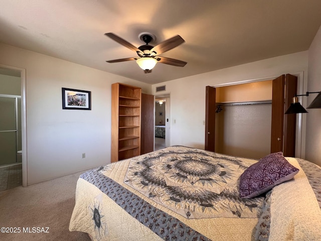 carpeted bedroom featuring ensuite bath, ceiling fan, and visible vents