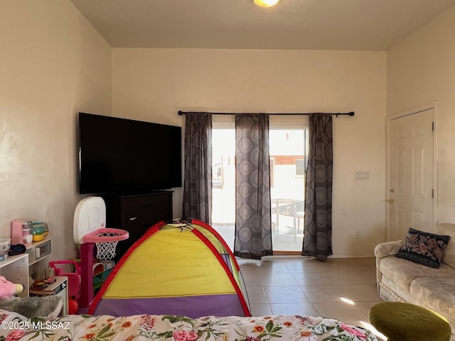 tiled bedroom featuring access to exterior