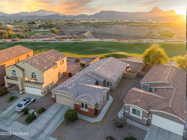 birds eye view of property featuring golf course view and a mountain view