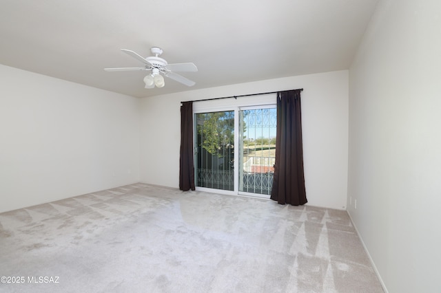 empty room with light carpet and ceiling fan